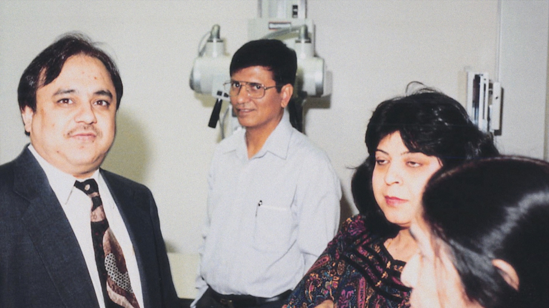 Clinicians in an exam room in the 1990s